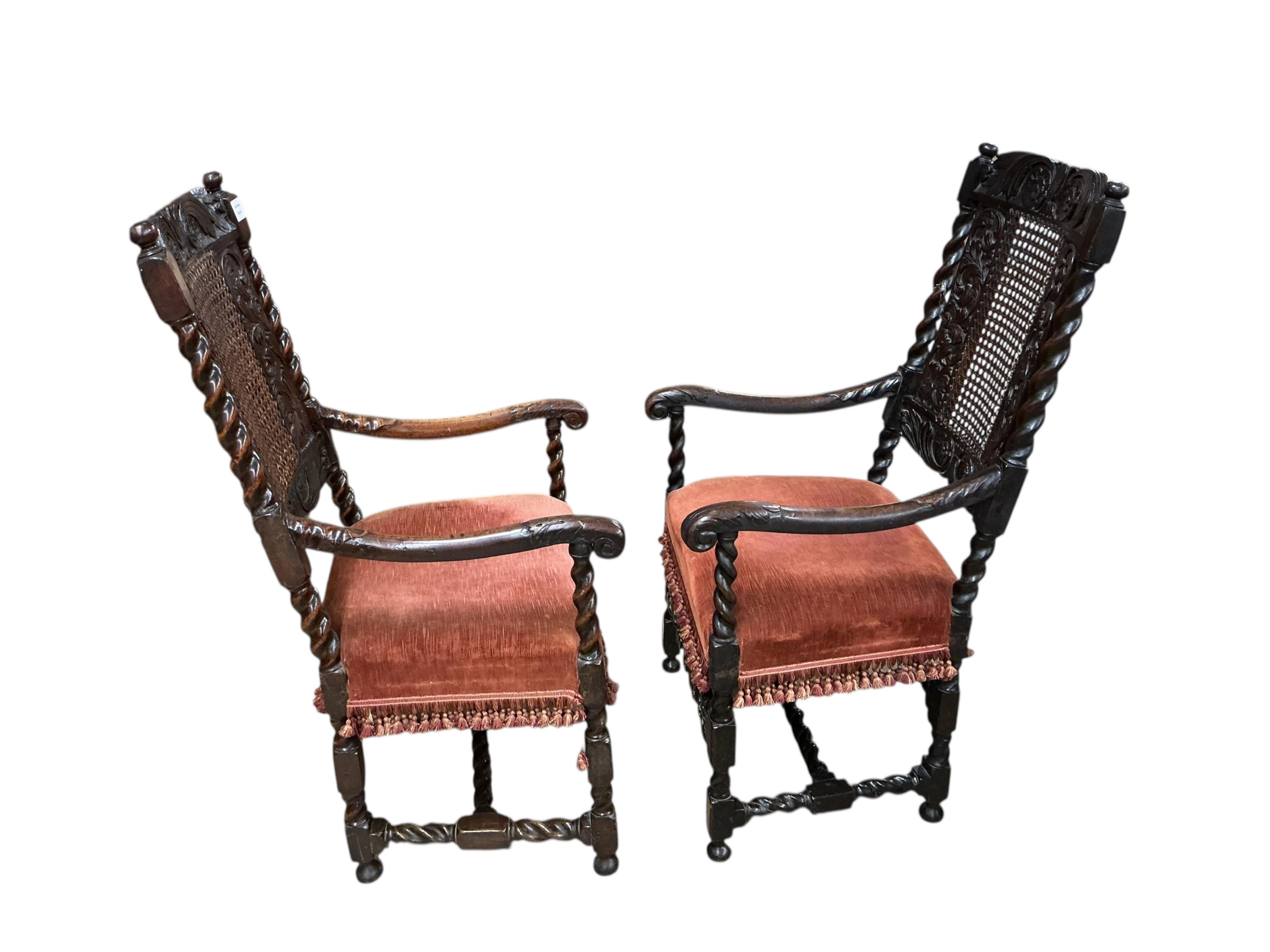 A set of four early 18th century caned walnut dining chairs, two with arms